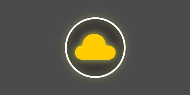 Icono amarillo y blanco con una nube amarilla en medio de un círculo, sobre fondo gris oscuro, que representa tejido suave de primera calidad.
